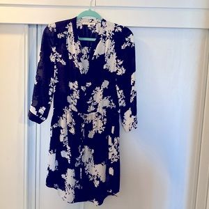 Black tunic dress with white floral pattern. Size M with 3/4 sleeves